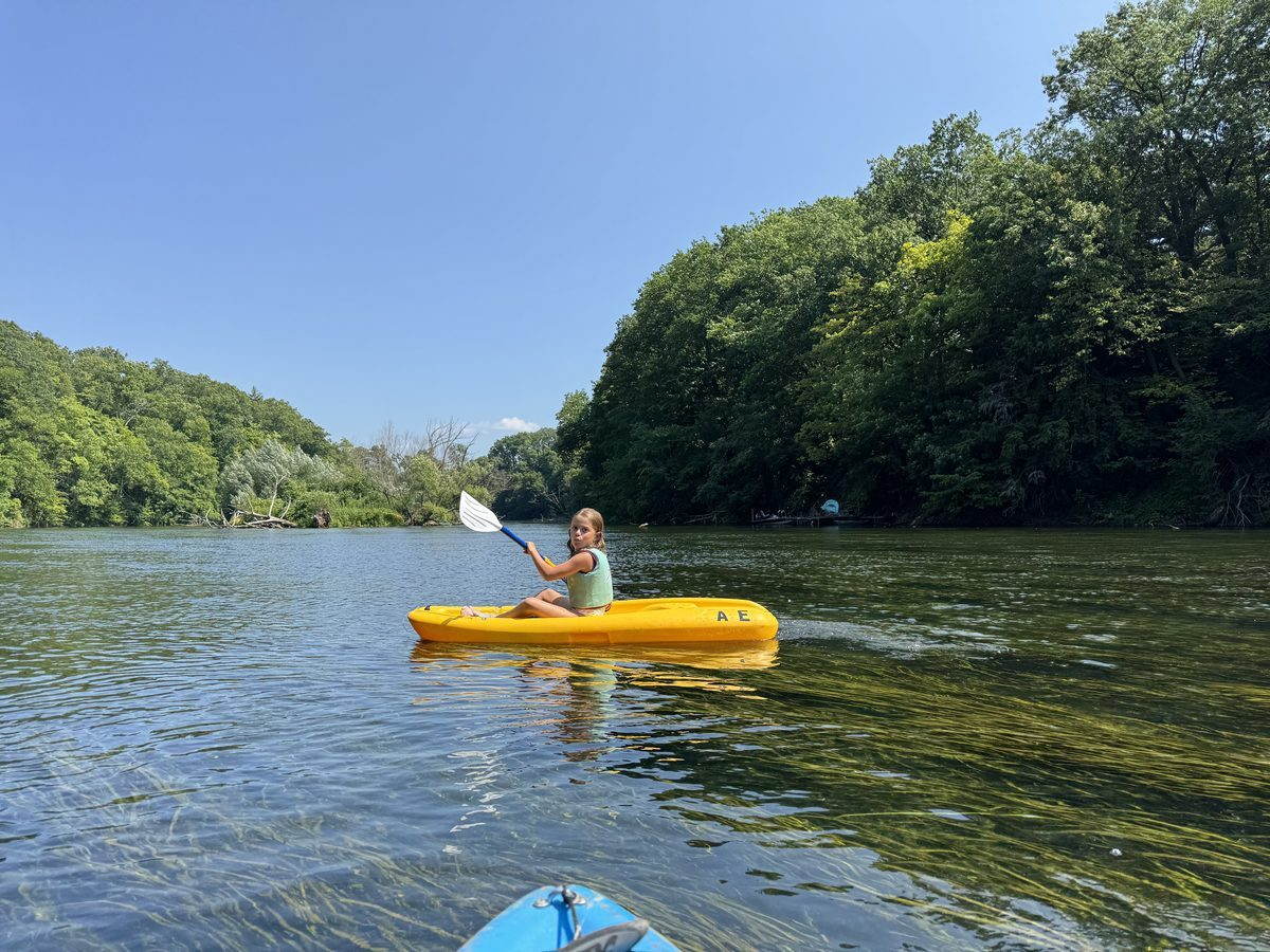 Kayaking on calm water at Waterport Pond above the Oak Orchard dam