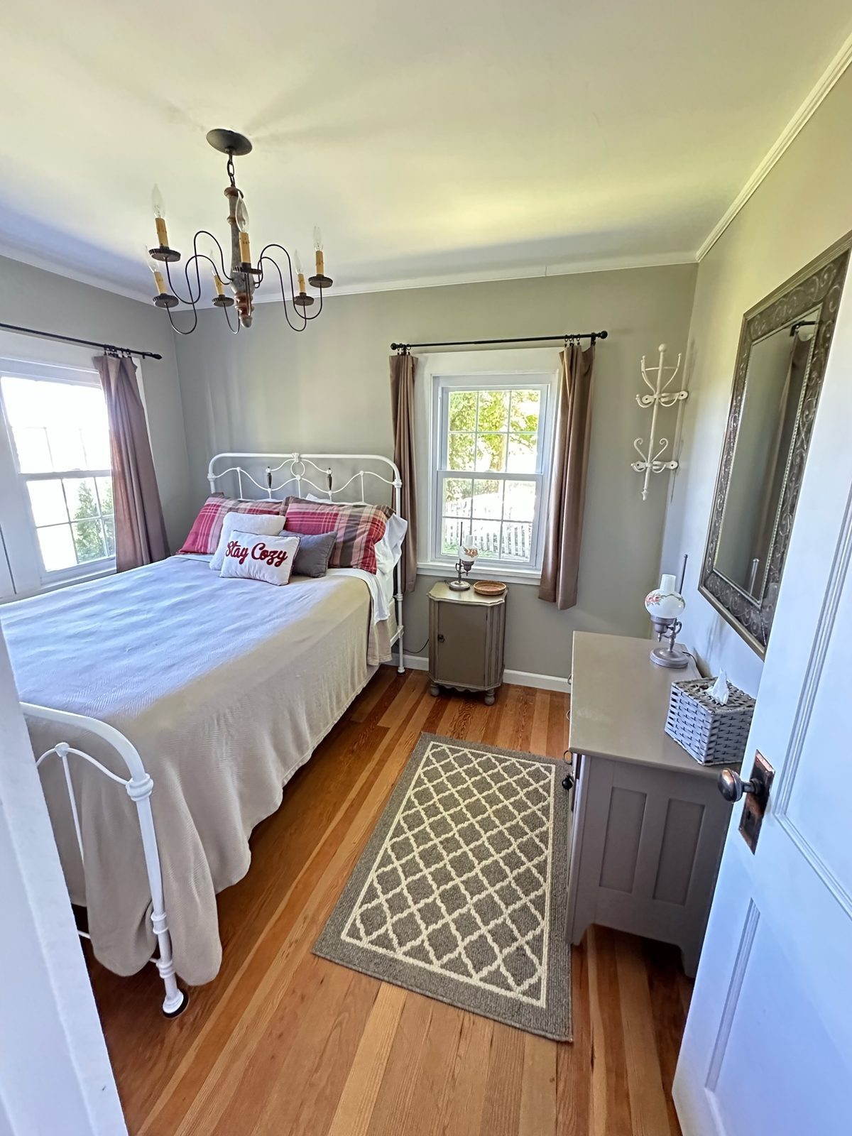Primary bedroom with queen bed and river view