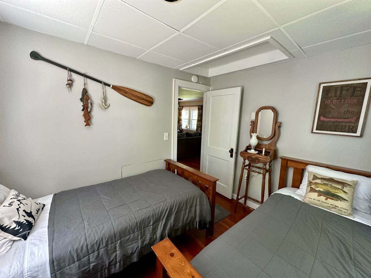 Second bedroom with two twin beds and reading area