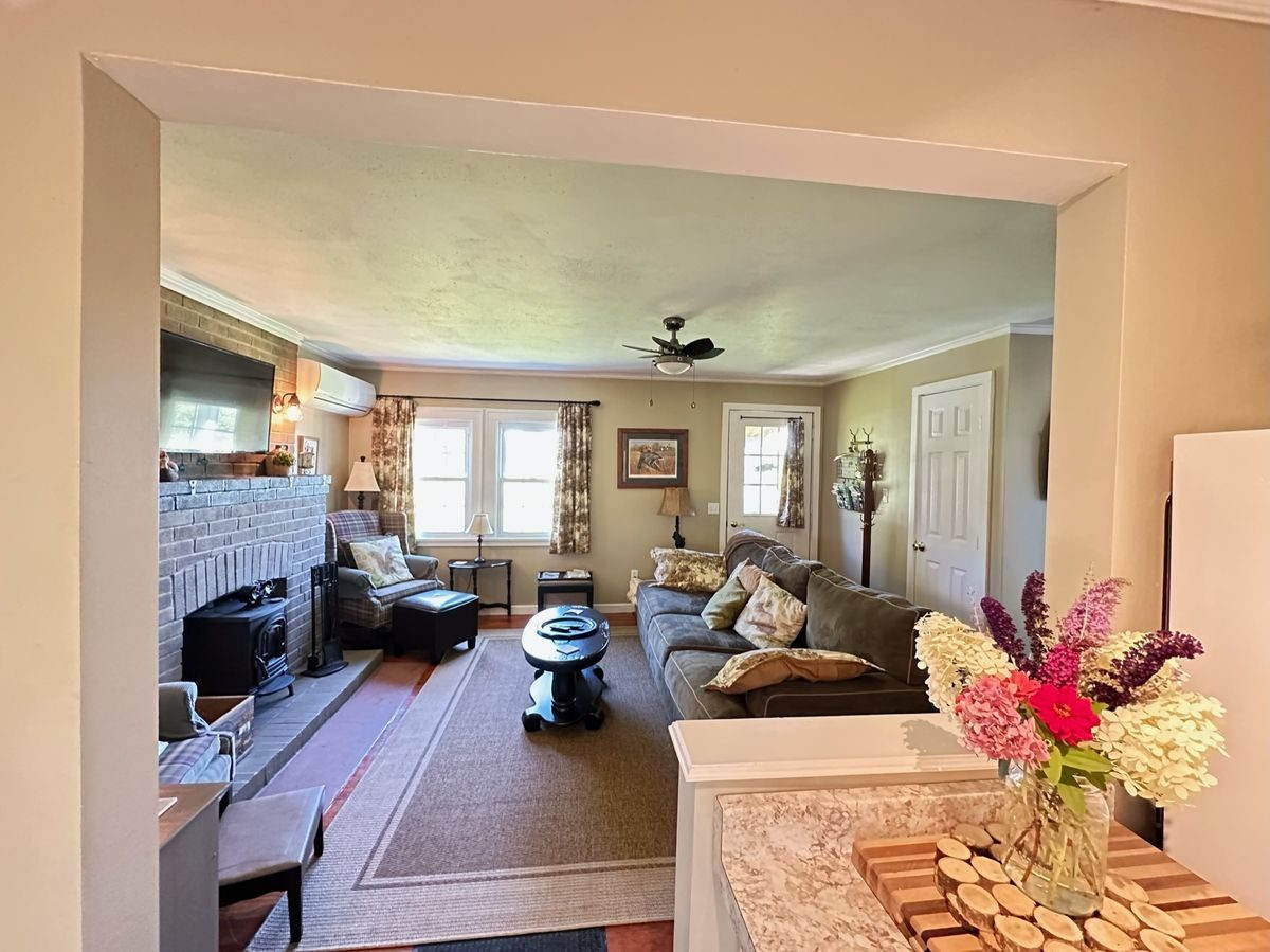 Living room interior with views of the Oak Orchard River